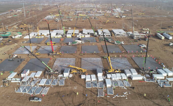 (210115) -- SHIJIAZHUANG, Jan. 15, 2021 (Xinhua) -- Aerial photo taken on Jan. 15, 2021 shows the construction site of a centralized medical observation center in Shijiazhuang, capital of north China s Hebei Province. As part of the measures to cope with the recent COVID-19 resurgence, authorities in Shijiazhuang have rushed to build a new isolation center with a designed capacity of 3,000 rooms in Zhengding County. Close contacts and sub-close contacts of confirmed COVID-19 patients will be placed under medical observation in the new center, which will cover a total area of about 33.3 hectares, according to the housing and urban-rural development bureau of Shijiazhuang. With an area of 18 square meters, each room will be equipped wit  - ZUMAHIJI XxjpbeE007311_20210115_PEPFN0A001 Copyright: xYangxShiyaox