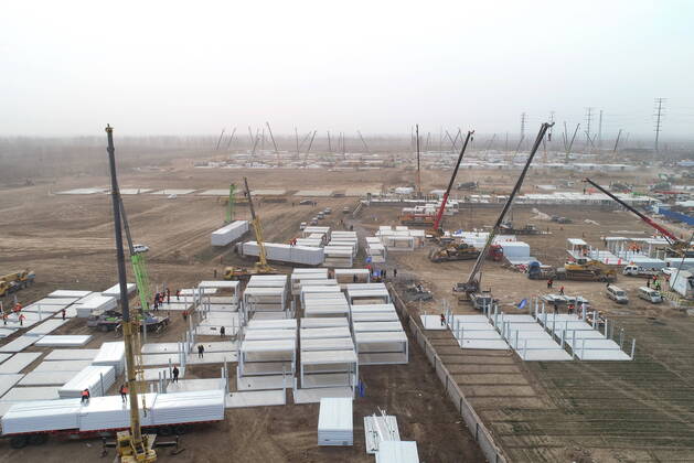(210115) -- SHIJIAZHUANG, Jan. 15, 2021 (Xinhua) -- Aerial photo taken on Jan. 15, 2021 shows the construction site of a centralized medical observation center in Shijiazhuang, capital of north China s Hebei Province. As part of the measures to cope with the recent COVID-19 resurgence, authorities in Shijiazhuang have rushed to build a new isolation center with a designed capacity of 3,000 rooms in Zhengding County. Close contacts and sub-close contacts of confirmed COVID-19 patients will be placed under medical observation in the new center, which will cover a total area of about 33.3 hectares, according to the housing and urban-rural development bureau of Shijiazhuang. With an area of 18 square meters, each room will be equipped wit  - ZUMAHIJI XxjpbeE007315_20210115_PEPFN0A001 Copyright: xYangxShiyaox