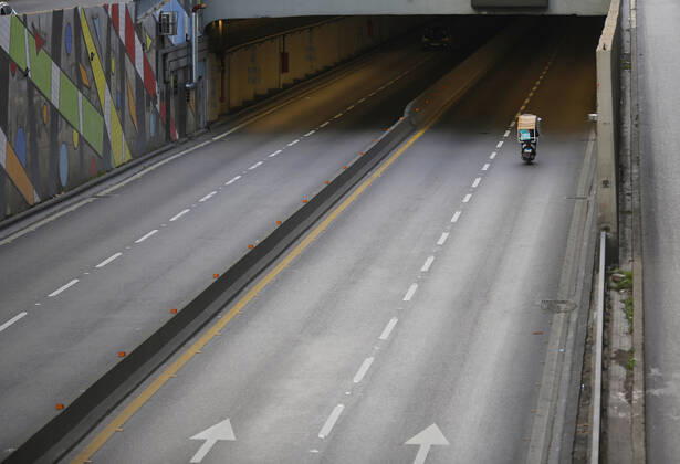 (210115) -- BEIRUT, Jan. 15, 2021 -- A delivery man rides a motorcycle during a total lockdown in Beirut, Lebanon, on Jan. 15, 2021. Lebanon registered on Friday 6,154 new COVID-19 cases, the highest daily increase in the country, raising the tally to 243,286, the Health Ministry reported. The death toll from the virus went up by 44 to 1,825, it added. ) LEBANON-BEIRUT-COVID-19-CASES BilalxJawich