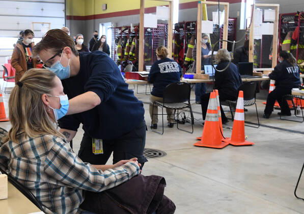 January 15, 2021, Oconomowoc, Wisconsin, USA: 119 firefighters and other front-line health profession workers were vaccinated against the Coronavirus with the Pfizer vaccine Friday January 15, 2021 at the Western Lakes Fire Department headquarters in Oconomowoc, Wisconsin, bringing the weekÃ¢â‚¬â ¢s total to 798. The rural fire department has six stations serving about 200 sq. miles. Paramedic ELAINE DALY was one of those who administered injections. Oconomowoc USA - ZUMAh154 20210115_znp_h154_029 Copyright: xMarkxHertzbergx