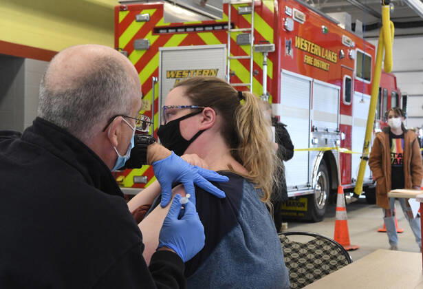January 15, 2021, Oconomowoc, Wisconsin, USA: 119 firefighters and other front-line health profession workers were vaccinated against the Coronavirus with the Pfizer vaccine Friday January 15, 2021 at the Western Lakes Fire Department headquarters in Oconomowoc, Wisconsin, bringing the weekÃ¢â‚¬â ¢s total to 798. The rural fire department has six stations serving about 200 sq. miles. EMT LOU MORGAN was one of those who administered vaccines. Oconomowoc USA - ZUMAh154 20210115_znp_h154_031 Copyright: xMarkxHertzbergx