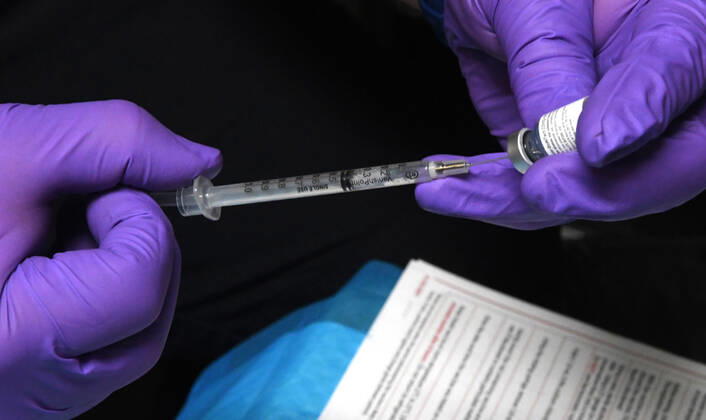 January 15, 2021, Oconomowoc, Wisconsin, USA: 119 firefighters and other front-line health profession workers were vaccinated against the Coronavirus with the Pfizer vaccine Friday January 15, 2021 at the Western Lakes Fire Department headquarters in Oconomowoc, Wisconsin, bringing the weekÃ¢â‚¬â ¢s total to 798. The rural fire department has six stations serving about 200 sq. miles. ADAM FRITSCH prepared doses of the vaccine after they were taken out of refrigeration. Oconomowoc USA - ZUMAh154 20210115_znp_h154_032 Copyright: xMarkxHertzbergx