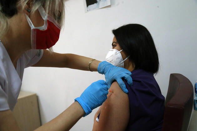 (210116) -- ANKARA, Jan. 16, 2021 -- A medical worker receives a dose of China s Sinovac COVID-19 vaccine at the Sabiha Uzun Maternal Child Health Center in Ankara, Turkey on Jan. 15, 2021. More than 600,000 health workers in Turkey have received their first doses of COVID-19 shots developed by China s Sinovac during the first two days of the country s vaccination program, Turkish Health Ministry s data showed on Friday. (Photo by Xinhua) TURKEY-ANKARA-HEALTH WORKER-COVID-19-VACCINATION MustafaxKaya 