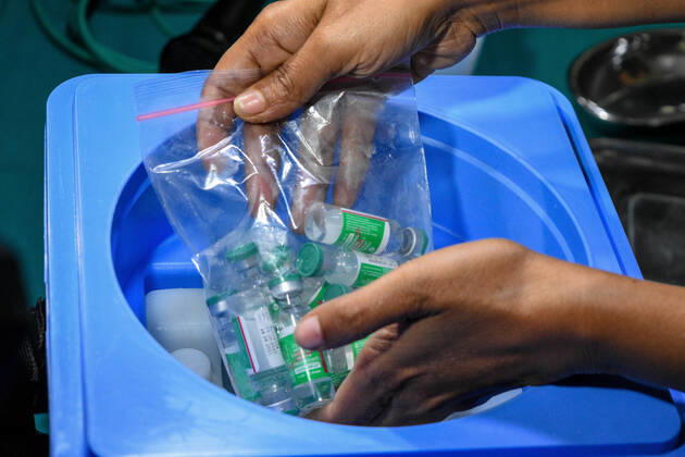 January 16, 2021, Kolkata, West Bengal, India: Sisters taking out COVISHIEALD vaccine from cold storage.With urgent effect , COVID vaccination drives starts in India from 16th of January 2021.The vaccination progrmae are allotted exclusive to the frontline health workers in its first phase of vaccine drive. As of now, COVISHIELD and COVAXIN has been approved by Indian government for use for vaccination. Kolkata India - ZUMAc211 20210116_zip_c211_005 Copyright: xDebarchanxChatterjeex