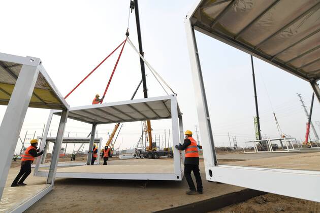 SHIJIAZHUANG, CHINA - JANUARY 16: Workers at the construction site of a centralized quarantine site with a total of 3,000 prefabricated rooms amid the coronavirus outbreak on January 16, 2021 in Shijiazhuang, Hebei Province of China.  Copyright: xVCGx CFP111313953231