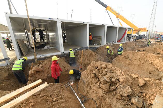 SHIJIAZHUANG, CHINA - JANUARY 16: Workers at the construction site of a centralized quarantine site with a total of 3,000 prefabricated rooms amid the coronavirus outbreak on January 16, 2021 in Shijiazhuang, Hebei Province of China.  Copyright: xVCGx CFP111313951288