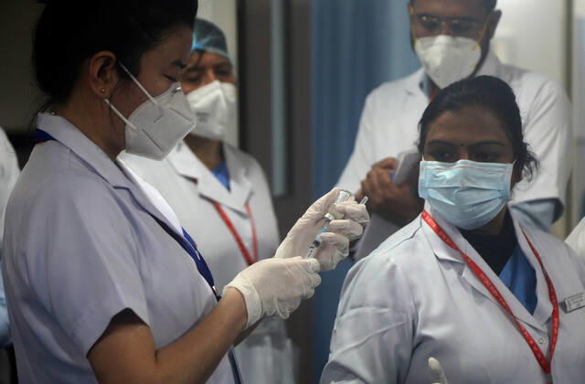 January 16, 2021, New Delhi, India: A nurse seen preparing a dose of vaccine to apply to a frontline medical worker at the All India Institute of Medical Science..The nationwide Covid-19 vaccination program began today in India. Frontline health workers are the first group of people to be vaccinated. New Delhi India - ZUMAs197 20210116_zaa_s197_105 Copyright: xNaveenxSharmax