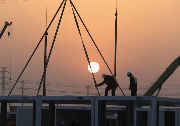 (210116) -- SHIJIAZHUANG, Jan. 16, 2021 -- Workers work at the construction site of a centralized medical observation center in Shijiazhuang, capital of north China s Hebei Province, Jan. 16, 2021. As part of the measures to cope with the recent COVID-19 resurgence, authorities in Shijiazhuang have rushed to build a new isolation center with a designed capacity of 3,000 rooms in Zhengding County. Close contacts and sub-close contacts of confirmed COVID-19 patients will be placed under medical observation in the new center, which will cover a total area of about 33.3 hectares, according to the housing and urban-rural development bureau of Shijiazhuang. With an area of 18 square meters, each room will be equipped with facilities such
