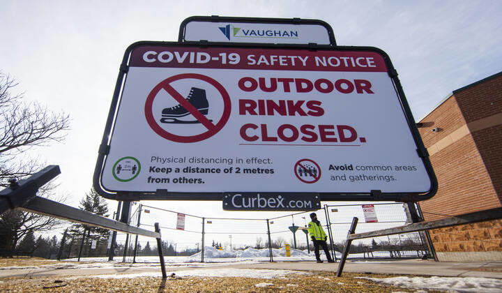 (210116) -- ONTARIO, Jan. 16, 2021 -- A security officer wearing a face mask is seen on duty outside a closed outdoor rink in Vaughan, Ontario, Canada, on Jan. 16, 2021. Canada s COVID-19 cases surpassed 700,000 on Saturday morning, with the total hitting 700,988, including 17,847 deaths, according to CTV. (Photo by Xinhua) CANADA-ONTARIO-COVID-19-CASES ZouxZheng