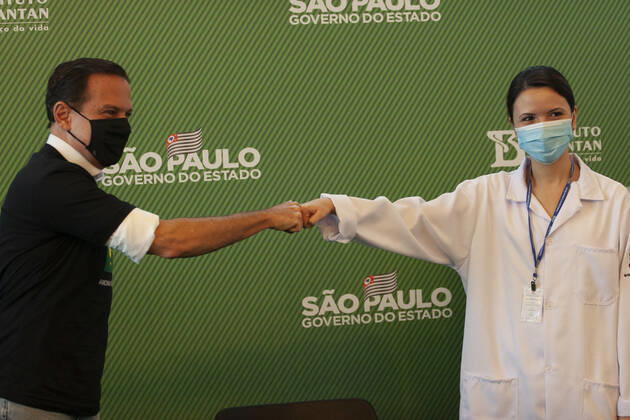 First COVID-19 Vaccination in Sao Paulo Brazil. First COVID-19 Vaccination in Sao Paulo Brazil. January 17, 2021, Sao Paulo, Brazil: The Governor of Sao Paulo, Joao Doria speaks during a press conference at Hospital das Clinicas - HCFMUSP, at the end of Anvisa s vote of approval on the emergency use of Butantan COVID-19 Vaccine and the first Brazilian to be vaccinated is a nurse called Monica Calazans, 54 years old, resident of Itaquera and who works on the front line against Covid-19 at the Instituto de Infectologia Emilio Ribas. She was vaccinated by Jessica Pires de Camargo, 30 years old, disease control nurse and Master of Public Health at Santa Casa de Sao Paulo. First COVID-19 Vaccination in Sao Paulo Brazil.  Copyright: xLecoxVianax