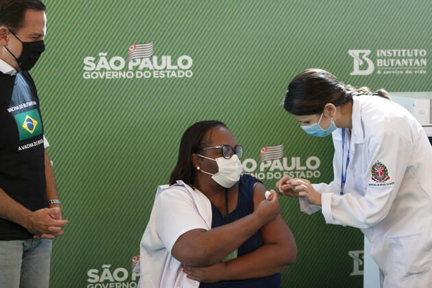 First COVID-19 Vaccination in Sao Paulo Brazil. First COVID-19 Vaccination in Sao Paulo Brazil. January 17, 2021, Sao Paulo, Brazil: The Governor of Sao Paulo, Joao Doria speaks during a press conference at Hospital das Clinicas - HCFMUSP, at the end of Anvisa s vote of approval on the emergency use of Butantan COVID-19 Vaccine and the first Brazilian to be vaccinated is a nurse called Monica Calazans, 54 years old, resident of Itaquera and who works on the front line against Covid-19 at the Instituto de Infectologia Emilio Ribas. She was vaccinated by Jessica Pires de Camargo, 30 years old, disease control nurse and Master of Public Health at Santa Casa de Sao Paulo. First COVID-19 Vaccination in Sao Paulo Brazil.  Copyright: xLecoxVianax
