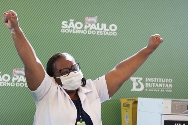 First COVID-19 Vaccination in Sao Paulo Brazil. First COVID-19 Vaccination in Sao Paulo Brazil. January 17, 2021, Sao Paulo, Brazil: The Governor of Sao Paulo, Joao Doria speaks during a press conference at Hospital das Clinicas - HCFMUSP, at the end of Anvisa s vote of approval on the emergency use of Butantan COVID-19 Vaccine and the first Brazilian to be vaccinated is a nurse called Monica Calazans, 54 years old, resident of Itaquera and who works on the front line against Covid-19 at the Instituto de Infectologia Emilio Ribas. She was vaccinated by Jessica Pires de Camargo, 30 years old, disease control nurse and Master of Public Health at Santa Casa de Sao Paulo. First COVID-19 Vaccination in Sao Paulo Brazil.  Copyright: xLecoxVianax