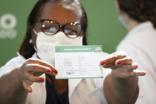 First COVID-19 Vaccination in Sao Paulo Brazil. First COVID-19 Vaccination in Sao Paulo Brazil. January 17, 2021, Sao Paulo, Brazil: The Governor of Sao Paulo, Joao Doria speaks during a press conference at Hospital das Clinicas - HCFMUSP, at the end of Anvisa s vote of approval on the emergency use of Butantan COVID-19 Vaccine and the first Brazilian to be vaccinated is a nurse called Monica Calazans, 54 years old, resident of Itaquera and who works on the front line against Covid-19 at the Instituto de Infectologia Emilio Ribas. She was vaccinated by Jessica Pires de Camargo, 30 years old, disease control nurse and Master of Public Health at Santa Casa de Sao Paulo. First COVID-19 Vaccination in Sao Paulo Brazil.  Copyright: xLecoxVianax