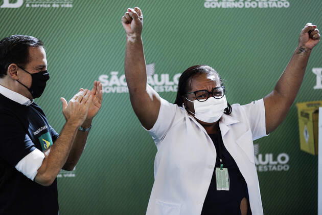 January 17, 2021, Sao Paulo, SP, Brazil: The National Health Surveillance Agency (ANVISA) approved the emergency use of the CoronaVac and Oxford AstraZeneca vaccines in Brazil. The governor of SoÂ£o Paulo, JOAO DORIA, followed the vaccination of nurse MONICA CALAZANS, 54, the first citizen to be immunized in the country with CoronaVac vaccine. Sao Paulo Brazil - ZUMAc168 20210117_zap_c168_006 Copyright: xMarceloxChellox