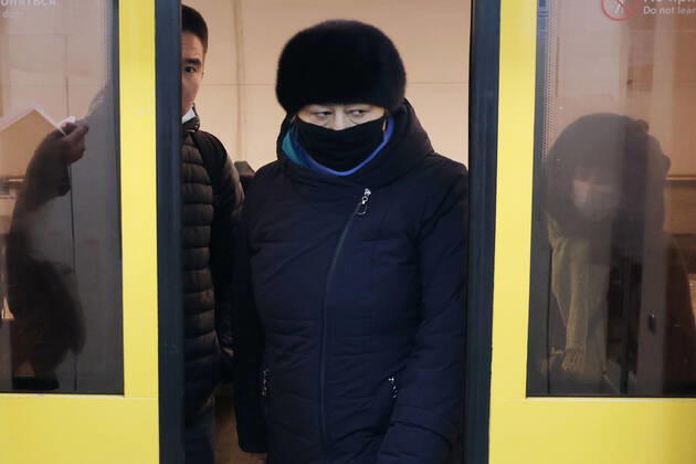 MOSCOW, RUSSIA - JANUARY 18, 2021: A woman in a face mask gets off a Moscow Metro train amid the ongoing COVID-19 pandemic. Vyacheslav Prokofyev TASS  TS0F47A1