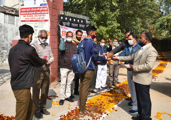 India: Teachers welcome students after schools reopen in Rajasthan Students greeted by teachers as they arrive to attend classes at a government school that was reopened after remaining closed for 309 days due to COVID-19 pandemic in Beawar. Beawar Rajasthan India Copyright: SumitxSaraswat