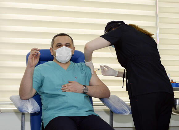 (210118) -- BAKU, Jan. 18, 2021 -- A medical worker receives a dose of China s Sinovac COVID-19 vaccine at a hospital in Baku, Azerbaijan, Jan. 18, 2021. Azerbaijan s senior health officials on Monday took their first inoculations of a vaccine made by Chinese biopharmaceutical company Sinovac Biotech, marking the beginning of mass vaccination against COVID-19 in the country, according to state-run news agency AZERTAC. (Photo by Xinhua) AZERBAIJAN-BAKU-HEALTH WORKER-COVID-19-VACCINATION TofikxBabayev 