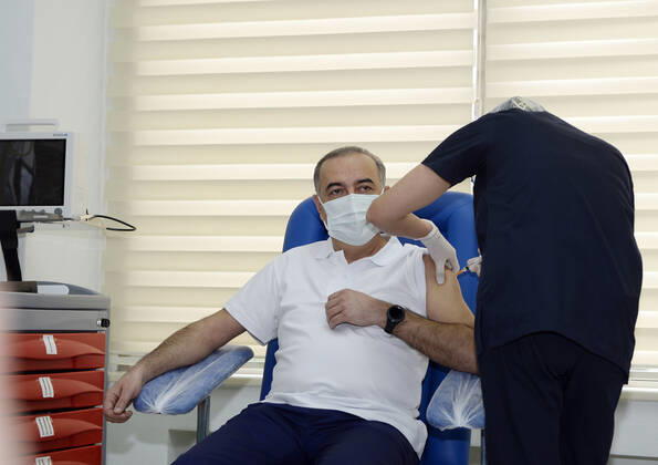 (210118) -- BAKU, Jan. 18, 2021 -- A medical worker receives a dose of China s Sinovac COVID-19 vaccine at a hospital in Baku, Azerbaijan, Jan. 18, 2021. Azerbaijan s senior health officials on Monday took their first inoculations of a vaccine made by Chinese biopharmaceutical company Sinovac Biotech, marking the beginning of mass vaccination against COVID-19 in the country, according to state-run news agency AZERTAC. (Photo by Xinhua) AZERBAIJAN-BAKU-HEALTH WORKER-COVID-19-VACCINATION TofikxBabayev 