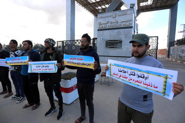 January 18, 2021, Rafah, Gaza Strip, Palestinian Territory: Palestinian protesters hold banners demanding for opening of the Rafah crossing for patients and students, in front of the Rafah border crossing, in Rafah in the southern of Gaza Strip, on January 18, 2021 Rafah Palestinian Territory - ZUMAap3_ 20210118_zaf_ap3_045 Copyright: xAshrafxAmrax