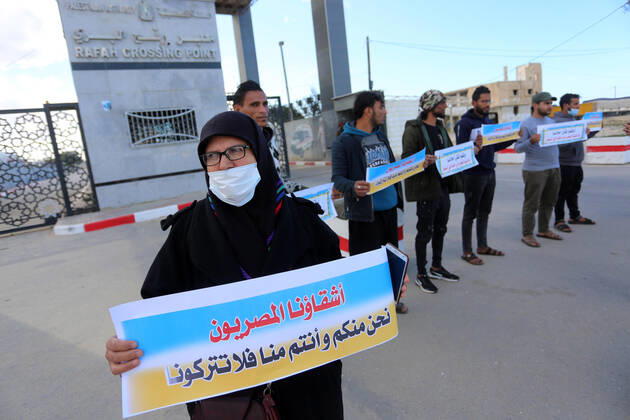 January 18, 2021, Rafah, Gaza Strip, Palestinian Territory: Palestinian protesters hold banners demanding for opening of the Rafah crossing for patients and students, in front of the Rafah border crossing, in Rafah in the southern of Gaza Strip, on January 18, 2021 Rafah Palestinian Territory - ZUMAap3_ 20210118_zaf_ap3_046 Copyright: xAshrafxAmrax