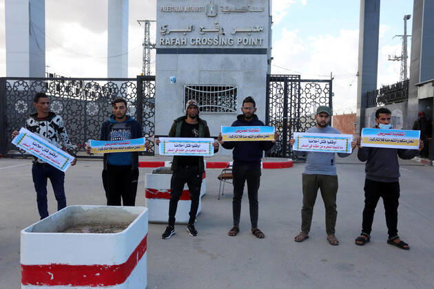 January 18, 2021, Rafah, Gaza Strip, Palestinian Territory: Palestinian protesters hold banners demanding for opening of the Rafah crossing for patients and students, in front of the Rafah border crossing, in Rafah in the southern of Gaza Strip, on January 18, 2021 Rafah Palestinian Territory - ZUMAap3_ 20210118_zaf_ap3_047 Copyright: xAshrafxAmrax