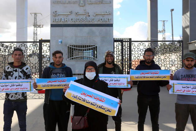 January 18, 2021, Rafah, Gaza Strip, Palestinian Territory: Palestinian protesters hold banners demanding for opening of the Rafah crossing for patients and students, in front of the Rafah border crossing, in Rafah in the southern of Gaza Strip, on January 18, 2021 Rafah Palestinian Territory - ZUMAap3_ 20210118_zaf_ap3_048 Copyright: xAshrafxAmrax