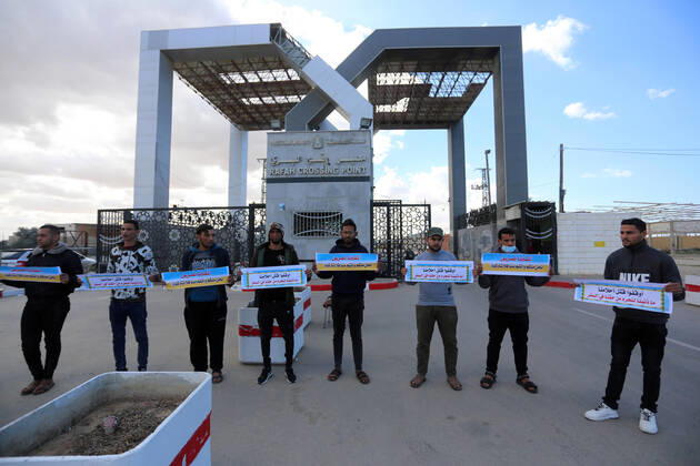 January 18, 2021, Rafah, Gaza Strip, Palestinian Territory: Palestinian protesters hold banners demanding for opening of the Rafah crossing for patients and students, in front of the Rafah border crossing, in Rafah in the southern of Gaza Strip, on January 18, 2021 Rafah Palestinian Territory - ZUMAap3_ 20210118_zaf_ap3_051 Copyright: xAshrafxAmrax