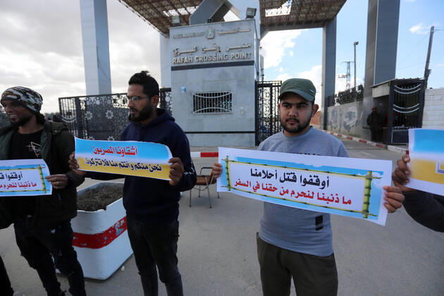 January 18, 2021, Rafah, Gaza Strip, Palestinian Territory: Palestinian protesters hold banners demanding for opening of the Rafah crossing for patients and students, in front of the Rafah border crossing, in Rafah in the southern of Gaza Strip, on January 18, 2021 Rafah Palestinian Territory - ZUMAap3_ 20210118_zaf_ap3_052 Copyright: xAshrafxAmrax