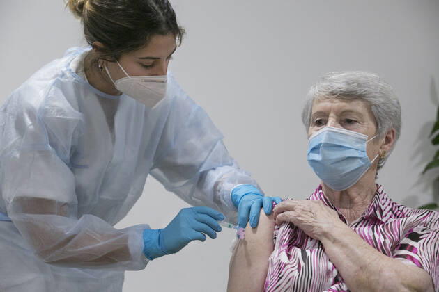Alegria Martinez is the third user of the residence to receive the second dose of the Pfizer-BioNTech coronavirus vaccine at the Centro Polivalente de Recursos Residencia Mixta in Gijon, the same place where vaccination began in Asturias, in Gijon, Principality of Asturias (Spain), on 18 January 2021. The Principality starts this Monday the administration of the second dose of vaccines against COVID-19. The autonomous community will complement in the coming days the first phase of the vaccination process that began last December 27. ASTURIAS LagenciaEP PRESS J.Peteiro. POOL 01 18 2021 Gijon (Asturias) Gijon (Asturias) Spain Copyright: xLagenciaEPxPRESS J.Peteiro.xPOOLx 3522272