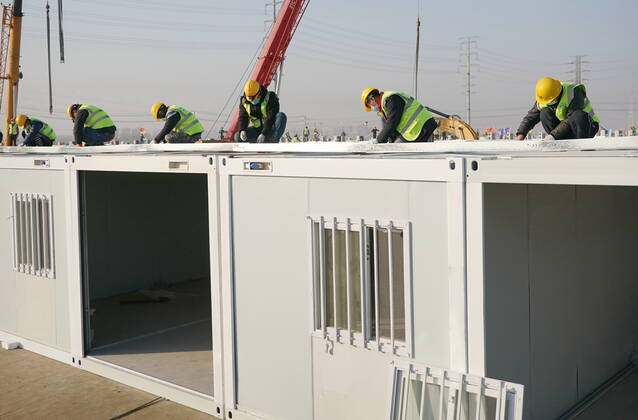 (210118) -- SHIJIAZHUANG, Jan. 18, 2021 -- Workers build the Huangzhuang apartment COVID-19 quarantine center in Shijiazhuang, north China s Hebei Province, Jan. 18, 2021. Construction of the main structures of the Huangzhuang apartment COVID-19 quarantine center in Shijiazhuang is nearing the end. With a total floor area of 34 hectares, the facility will house close contacts or secondary close contacts of COVID-19 confirmed cases. ) CHINA-HEBEI-SHIJIAZHUANG-COVID-19-QUARANTINE CENTER-CONSTRUCTION (CN) YangxShiyao 