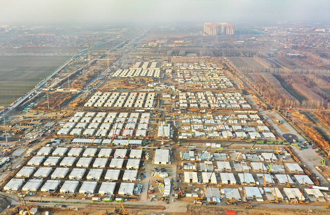 (210118) -- SHIJIAZHUANG, Jan. 18, 2021 -- Aerial photo taken on Jan. 18, 2021 shows the Huangzhuang apartment COVID-19 quarantine center under construction in Shijiazhuang, north China s Hebei Province. Construction of the main structures of the Huangzhuang apartment COVID-19 quarantine center in Shijiazhuang is nearing the end. With a total floor area of 34 hectares, the facility will house close contacts or secondary close contacts of COVID-19 confirmed cases. ) CHINA-HEBEI-SHIJIAZHUANG-COVID-19-QUARANTINE CENTER-CONSTRUCTION (CN) YangxShiyao 