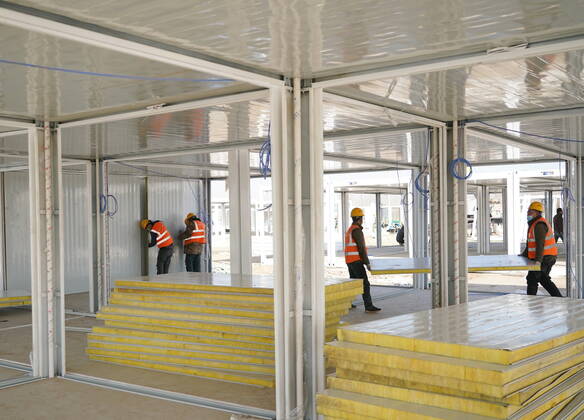 (210118) -- SHIJIAZHUANG, Jan. 18, 2021 -- Workers build the Huangzhuang apartment COVID-19 quarantine center in Shijiazhuang, north China s Hebei Province, Jan. 18, 2021. Construction of the main structures of the Huangzhuang apartment COVID-19 quarantine center in Shijiazhuang is nearing the end. With a total floor area of 34 hectares, the facility will house close contacts or secondary close contacts of COVID-19 confirmed cases. ) CHINA-HEBEI-SHIJIAZHUANG-COVID-19-QUARANTINE CENTER-CONSTRUCTION (CN) YangxShiyao 