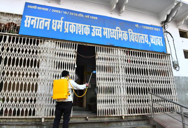India: Schools reopened after 10 months in Rajasthan Worker sanitise a school that was reopened after remaining closed for 309 days due to COVID-19 pandemic in Beawar. Beawar Rajasthan India Copyright: SumitxSaraswat