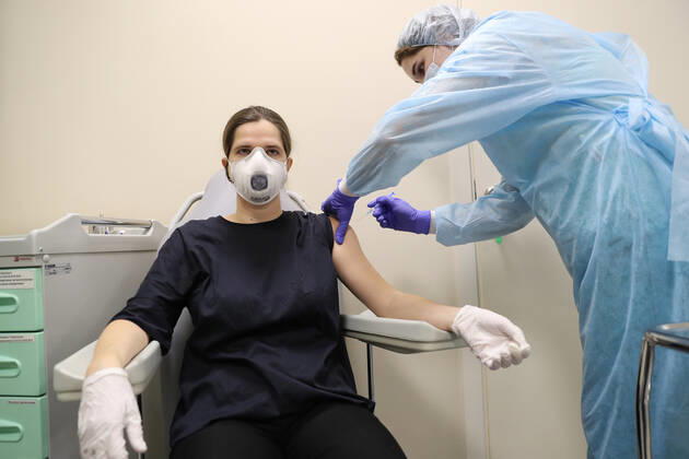 MOSCOW, RUSSIA - JANUARY 18, 2021: A woman is vaccinated with Gam-COVID-Vac (Sputnik V), a COVID-19 vaccine, at a private clinic of the Medsi chain. Sergei Savostyanov TASS  TS0F486F
