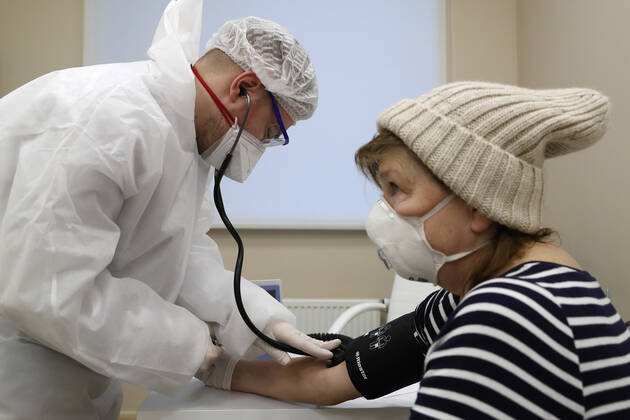 MOSCOW, RUSSIA - JANUARY 18, 2021: A woman has her blood pressure measured ahead of being vaccinated with Gam-COVID-Vac (Sputnik V), a COVID-19 vaccine, at a private clinic of the Medsi chain. Sergei Savostyanov TASS  TS0F4887