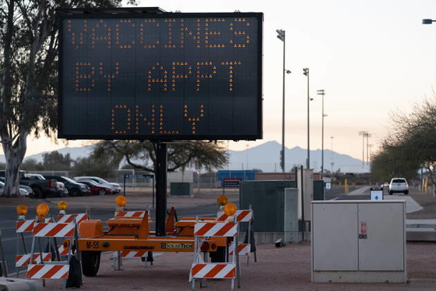 January 18, 2021, Tucson, Arizona, USA: A sign directs people to a Covid-19 vaccination site in Tucson, Arizona, U.S., January 18, 2021. Pima County is moving into Phase 1B of Covid-19 vaccinations as hospitalizations and deaths continue to climb throughout Arizona and the stateÃ¢â‚¬â ¢s new-case rate again ranked highest in the country. Tucson USA - ZUMAo111 20210118_znp_o111_001 Copyright: xCheneyxOrrx