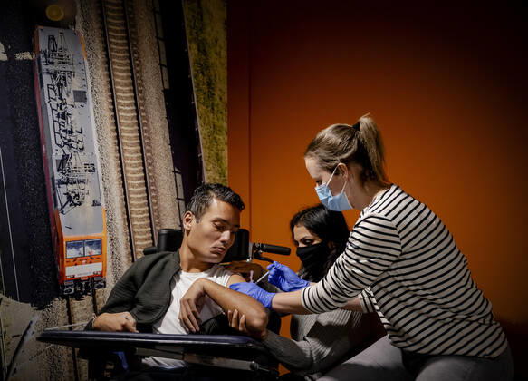 Virendra (L) receives the vaccine in residential care center Westerhonk in Monster, The Netherlands, 18 January 2021. In the center for people with an mental disorder in s Heeren Loo, a start has been made with vaccinating the most vulnerable clients against the coronavirus. ANP ROBIN VAN LONKHUIJSEN Copyright: xHollandsexHoogtex xxANPx x427226088x