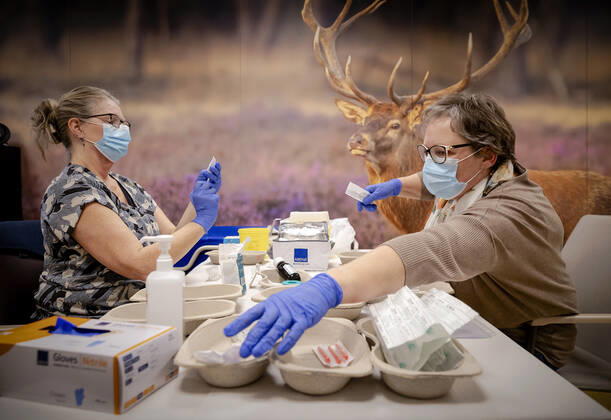 Employees prepare vaccines in residential care center Westerhonk in Monster, The Netherlands, 18 January 2021. In the center for people with an mental disorder in s Heeren Loo, a start has been made with vaccinating the most vulnerable clients against the coronavirus. ANP ROBIN VAN LONKHUIJSEN Copyright: xHollandsexHoogtex xxANPx x427226392x