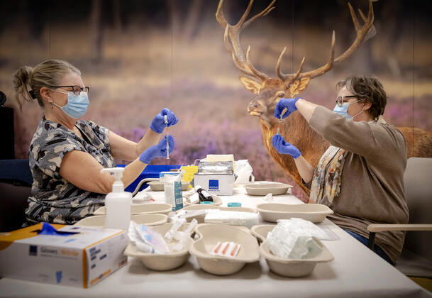 Employees prepare vaccines in residential care center Westerhonk in Monster, The Netherlands, 18 January 2021. In the center for people with an mental disorder in s Heeren Loo, a start has been made with vaccinating the most vulnerable clients against the coronavirus. ANP ROBIN VAN LONKHUIJSEN Copyright: xHollandsexHoogtex xxANPx x427226400x