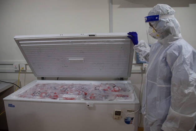 January 18, 2021, Kathmandu, Nepal: A laboratory technologist Srijana Adhikari wearing a personal protective equipment (PPE) manages COVID-19 samples in a freezer inside the COVID-19 lab at the Bidh Lab. .Nepal has confirmed that a new variant of coronavirus has entered Nepal as well. Issuing a statement on Monday the Ministry of Health and Population stated that three out of six people who arrived here from the UK a few days ago are found infected with the new variant. Kathmandu Nepal - ZUMAs197 20210118_zaa_s197_107 Copyright: xPrabinxRanabhatx