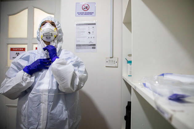 January 18, 2021, Kathmandu, Nepal: A laboratory technologist Srijana Adhikari adjusts her personal protective equipment (PPE) at the Bidh Lab..Nepal has confirmed that a new variant of coronavirus has entered Nepal as well. Issuing a statement on Monday the Ministry of Health and Population stated that three out of six people who arrived here from the UK a few days ago are found infected with the new variant. Kathmandu Nepal - ZUMAs197 20210118_zaa_s197_109 Copyright: xPrabinxRanabhatx