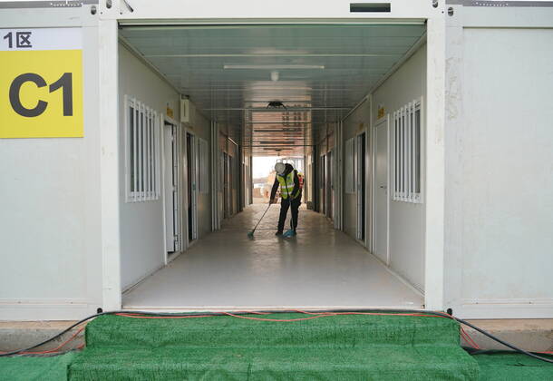 (210119) -- SHIJIAZHUANG, Jan. 19, 2021 -- A worker cleans up the hallway in the first batch of buildings to be delivered at Huangzhuang Apartment COVID-19 quarantine center in Shijiazhuang, north China s Hebei Province, Jan. 19, 2021. With 606 quarantine rooms and supporting facilities delivered on Tuesday, the construction of the Huangzhuang Apartment COVID-19 quarantine center in Shijiazhuang is about to be completed. Close contacts and sub-close contacts of confirmed COVID-19 patients will be placed under medical observation in the new center with a total of 4,156 rooms. ) CHINA-HEBEI-SHIJIAZHUANG-COVID-19-QUARANTINE CENTER-CONSTRUCTION (CN) YangxShiyao 