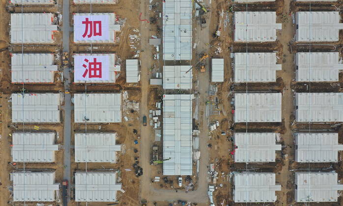 (210119) -- SHIJIAZHUANG, Jan. 19, 2021 -- Aerial photo shows workers working at the construction site of the Huangzhuang Apartment COVID-19 quarantine center in Shijiazhuang, north China s Hebei Province, Jan. 19, 2021. With 606 quarantine rooms and supporting facilities delivered on Tuesday, the construction of the Huangzhuang Apartment COVID-19 quarantine center in Shijiazhuang is about to be completed. Close contacts and sub-close contacts of confirmed COVID-19 patients will be placed under medical observation in the new center with a total of 4,156 rooms. ) CHINA-HEBEI-SHIJIAZHUANG-COVID-19-QUARANTINE CENTER-CONSTRUCTION (CN) YangxShiyao 