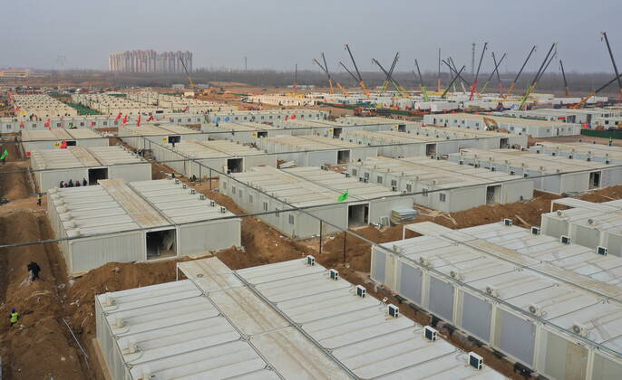 (210119) -- SHIJIAZHUANG, Jan. 19, 2021 -- Aerial photo taken on Jan. 19, 2021 shows the construction site of the Huangzhuang Apartment COVID-19 quarantine center in Shijiazhuang, north China s Hebei Province. With 606 quarantine rooms and supporting facilities delivered on Tuesday, the construction of the Huangzhuang Apartment COVID-19 quarantine center in Shijiazhuang is about to be completed. Close contacts and sub-close contacts of confirmed COVID-19 patients will be placed under medical observation in the new center with a total of 4,156 rooms. ) CHINA-HEBEI-SHIJIAZHUANG-COVID-19-QUARANTINE CENTER-CONSTRUCTION (CN) YangxShiyao 