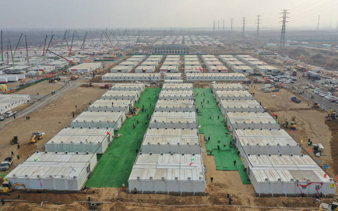 (210119) -- SHIJIAZHUANG, Jan. 19, 2021 -- Aerial photo shows workers tidying up the ground of the first batch of buildings to be delivered at Huangzhuang Apartment COVID-19 quarantine center in Shijiazhuang, north China s Hebei Province, Jan. 19, 2021. With 606 quarantine rooms and supporting facilities delivered on Tuesday, the construction of the Huangzhuang Apartment COVID-19 quarantine center in Shijiazhuang is about to be completed. Close contacts and sub-close contacts of confirmed COVID-19 patients will be placed under medical observation in the new center with a total of 4,156 rooms. ) CHINA-HEBEI-SHIJIAZHUANG-COVID-19-QUARANTINE CENTER-CONSTRUCTION (CN) YangxShiyao 