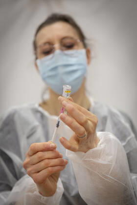 A health worker prepares a syringe with a dose of the Pfizer-BioNTech COVID-19 vaccine at a vaccination centre in Saint-Gregoire near Rennes, western France on January 19, 2021, during a Covid-19 vaccination campaign for people over 75.  Copyright: xJeremiasxGonzalezx