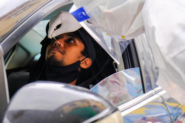 January 19, 2021, Shah Alam, Selangor, Malaysia: A medical personnel from Nur Ajwa private clinic takes a swab sample during the Covid-19 drive-thru screening test at Shah Alam...Ismail Sabri Yaakob the Malaysia Senior Minister has announced that all states in Malaysia will be on Movement Control Order (MCO) except the state of Sarawak. Malaysia had recorded 3,631 new cases of Covid-19 today which bring the total up to 165,371 cases. Shah Alam Malaysia - ZUMAs197 20210119_zaa_s197_049 Copyright: xFarisxHadziqx