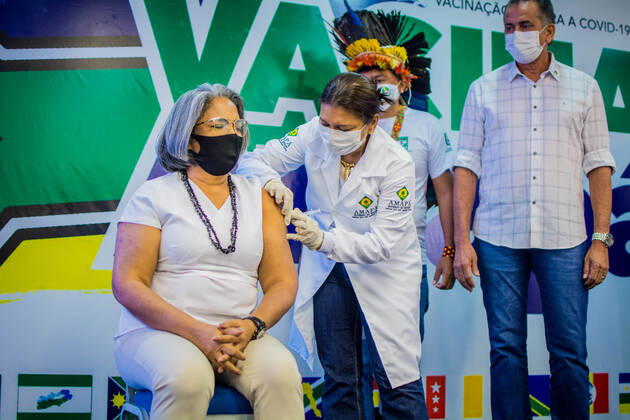MACAPÁ, AP - 19.01.2021: BEGINNING OF VACCINATION IN AMAPÁ - At 11 am, on the dot, this Tuesday (19) the first vaccine against Covid-19 in Amapá was applied. Nurse Kátia Regina Marinho de Araújo, 58 years old, working in health for 3 decades, received the dose in a ceremony at the Palácio do Setentrião, seat of the state government. Then, the indigenous Demétrio Amisio, 46, also a nurse, was vaccinated. x2020431x MaksuelxMartins