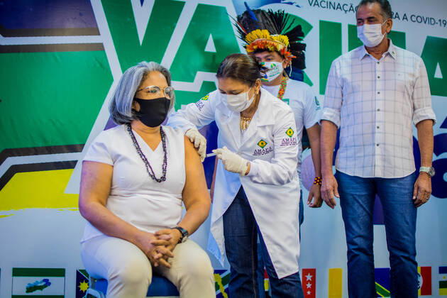 MACAPÁ, AP - 19.01.2021: BEGINNING OF VACCINATION IN AMAPÁ - At 11 am, on the dot, this Tuesday (19) the first vaccine against Covid-19 in Amapá was applied. Nurse Kátia Regina Marinho de Araújo, 58 years old, working in health for 3 decades, received the dose in a ceremony at the Palácio do Setentrião, seat of the state government. Then, the indigenous Demétrio Amisio, 46, also a nurse, was vaccinated. x2020432x MaksuelxMartins