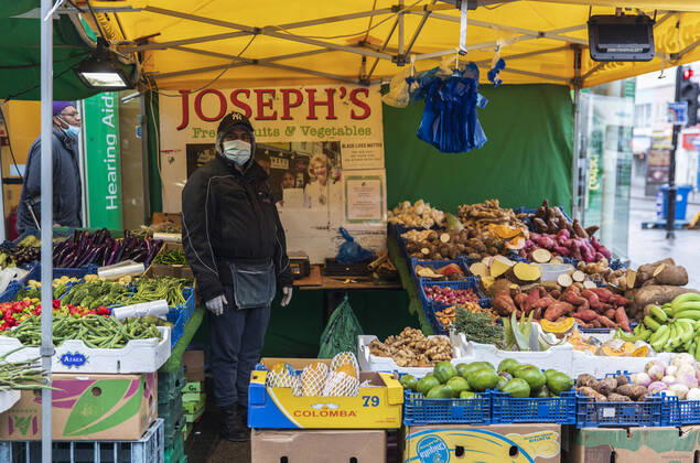 January 19, 2021, London, United Kingdom: A seller standing at a vegetable stall in Croydon, a large town of south London, UK on January 18, 2021. Only 33,355 positive Covid cases have been recorded today, the lowest number of daily case since December 27th- before the start of EnglandÃ¢â‚¬â ¢s third nationwide lockdown. London United Kingdom - ZUMAj323 20210119_zip_j323_004 Copyright: xMayxJamesx